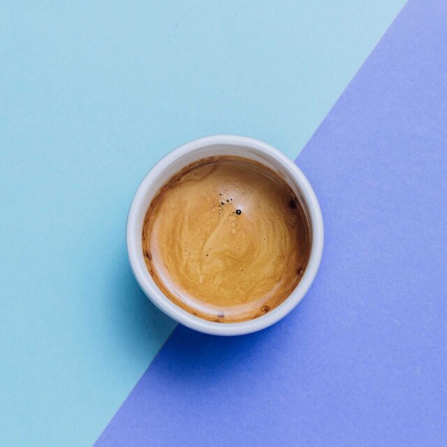 espresso on top o blue and purple background