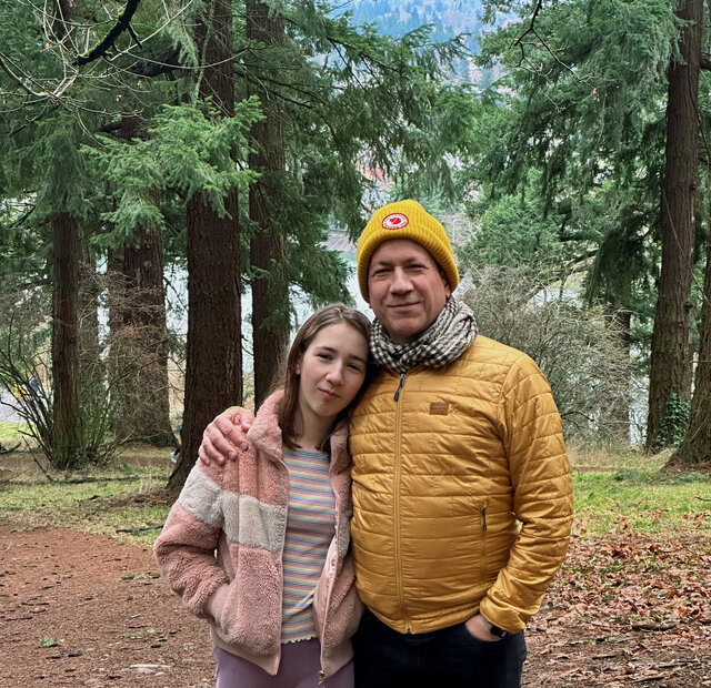 The author in the yellow jacket with their kiddo