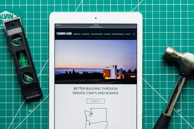 Hammer & Hand website showcased on an iPhone.