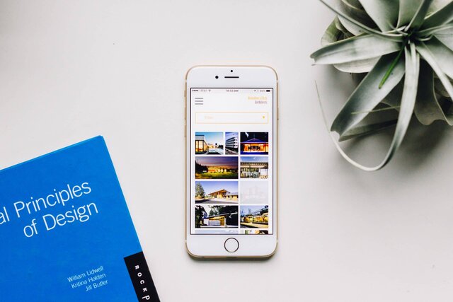 Hennebery Eddy website redesign shown on an iPhone.