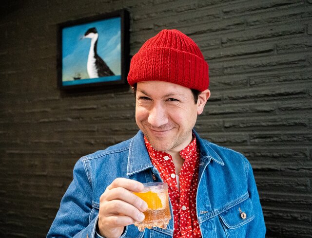 Ray holding up his drink recipe
