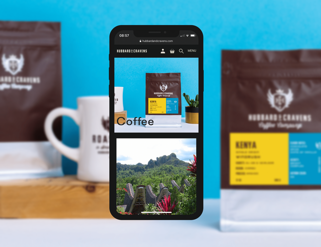 mobile coffee landing page on blurred out blue background with coffee packaging