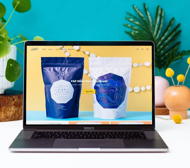 Home page of Junior's Roasted Coffee website featuring vibrant photography