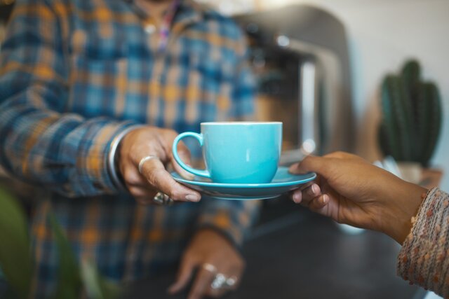 Customer service, cafe and hands of people with coffee for drinking, breakfast or lunch in restaurant